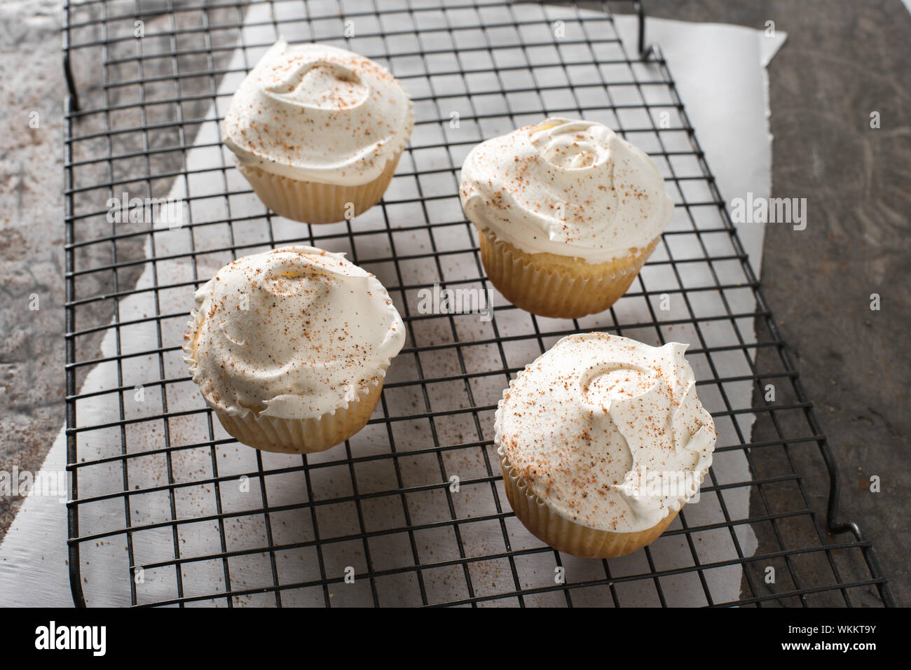 High Angle View Of Cupcakes On Cooling Rack Stock Photo