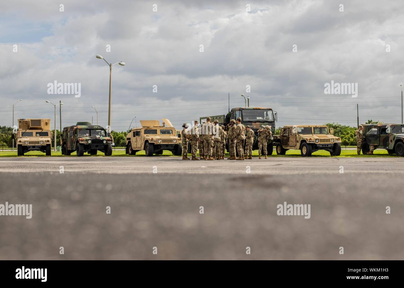 Kissimmee, Fla, September 3, 2019. - Florida National Guard Soldiers with the 753rd Brigade Engineer Battalion in Tallahassee, Florida, gather together after staging their vehicles, Sept. 3, 2019. The 753rd is staging their vehicles and Soldiers in preparation to respond to Hurricane Dorian. () Stock Photo