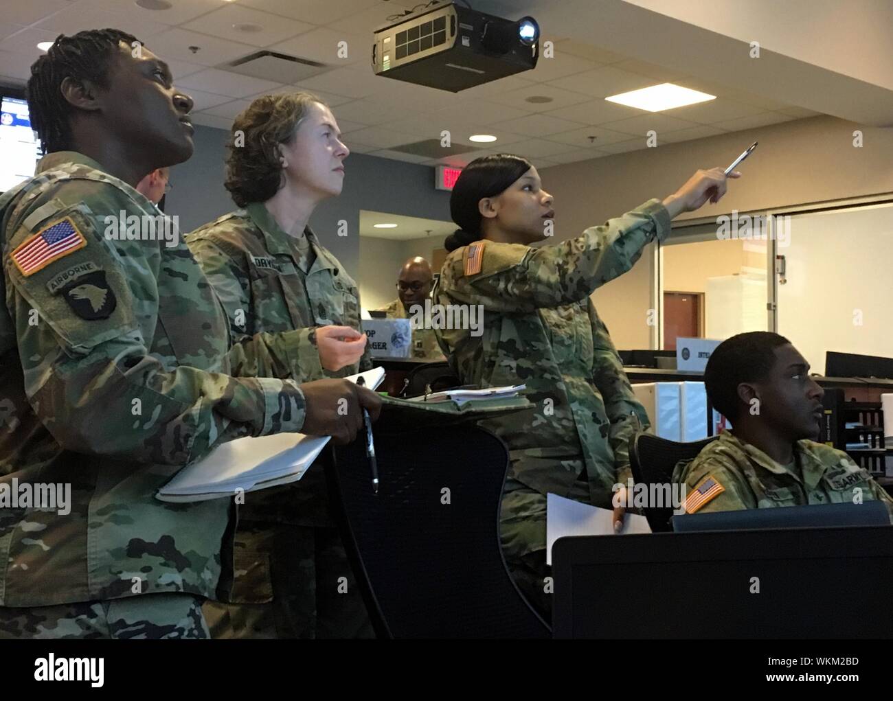 Georgia Army National Guard Soldiers review possible Hurricane Dorian mission scenarios in the Ga, September 3, 2019. DoD Joint Operations Center in Marietta, Ga. Sept 3, 2019. The Soldiers are Sgt. 1st Class Toya Cullwell, Sergeant Major Rachel Dryden, Sgt. Shaztada Wilson and Sgt. Eric Cooper. () Stock Photo