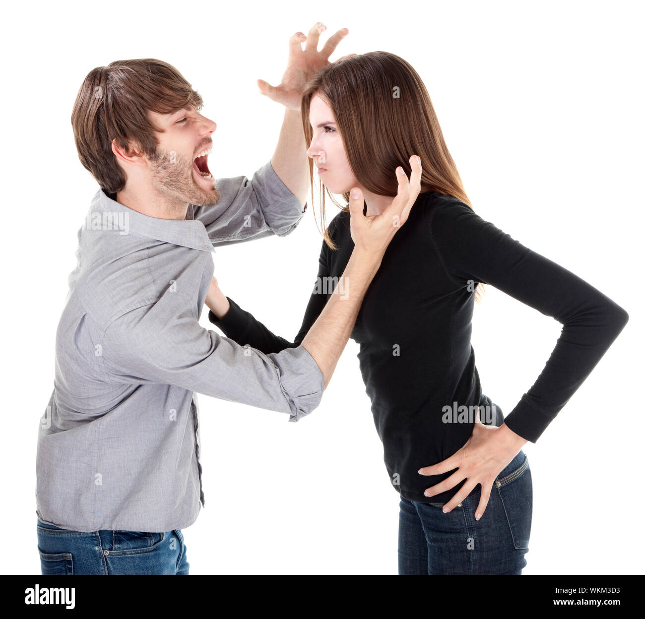Young Caucasian woman holding her boyfriend or husband by his collar