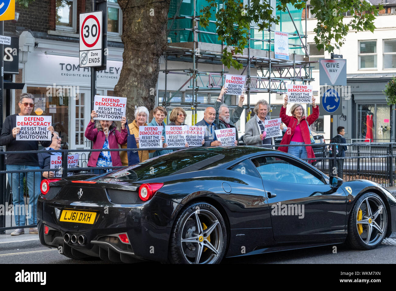 Brentwood, Essex, UK. 4th September 2019 Mini "Defend democracy" protest in the High Street of Brentwood, Essex, UK with .2012 Ferrari 458 Italia Dct Credit: Ian Davidson/Alamy Live News Stock Photo