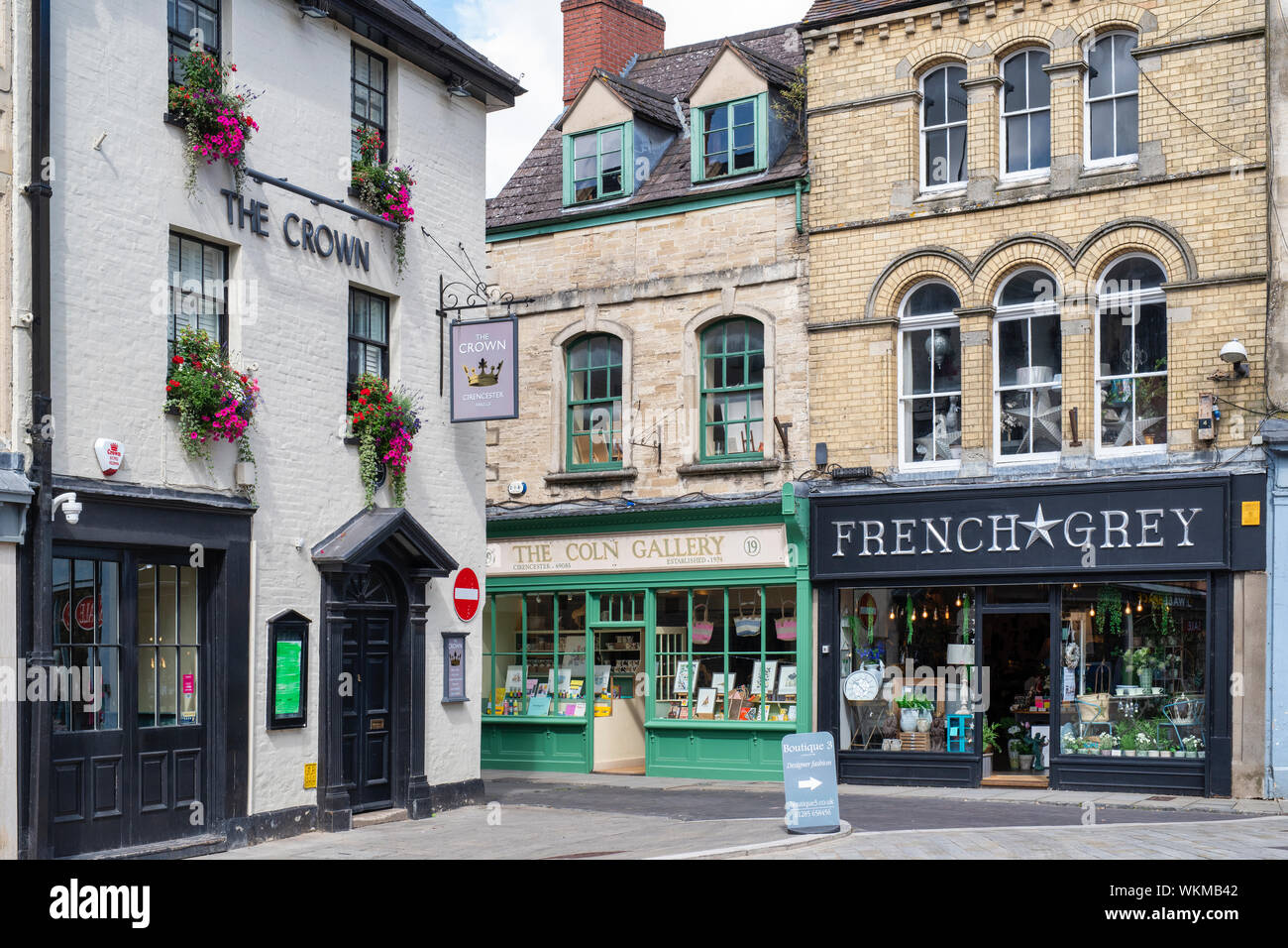 The Crown Inn and black jack street shops. Cirencester, Cotswolds, Gloucestershire, England Stock Photo