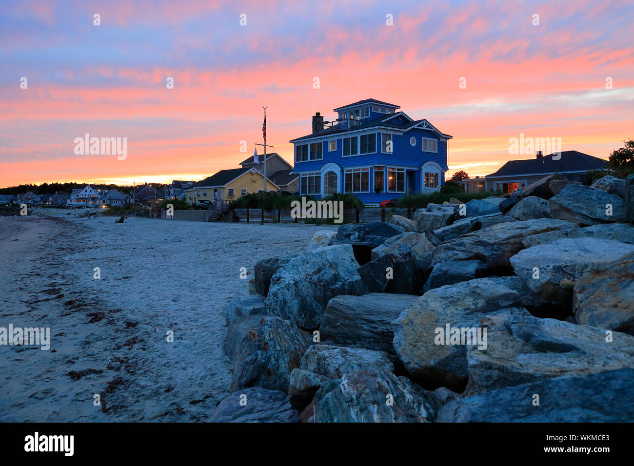 Sunset at Higgins Beach with residential houses in background