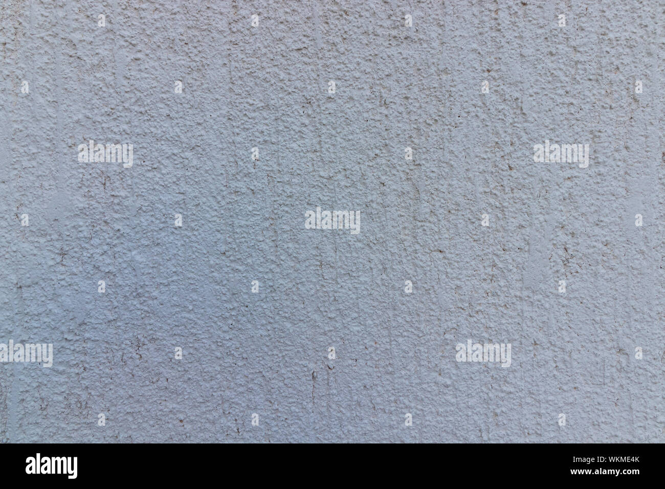 the rugged white surface of the home facade Stock Photo