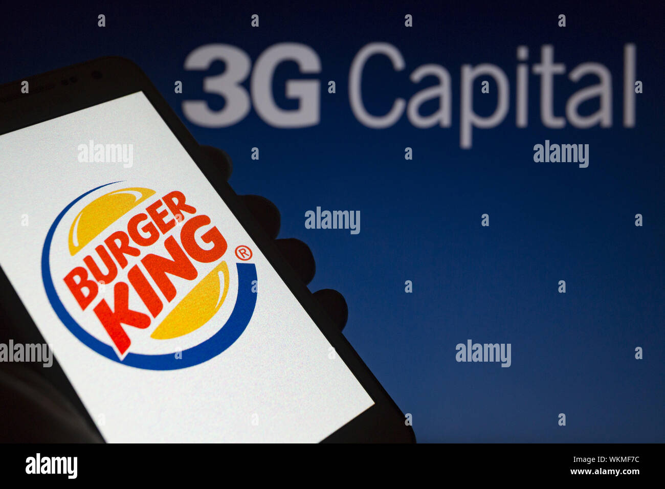 Asuncion, Paraguay. 4th Sep, 2019. Logo of Burger King, an American global chain of hamburger fast food restaurants is seen on a smartphone screen against the 3G Capital logo, a Brazilian-American global investment firm, unfocused on background. Credit: Andre M. Chang/ZUMA Wire/Alamy Live News Stock Photo
