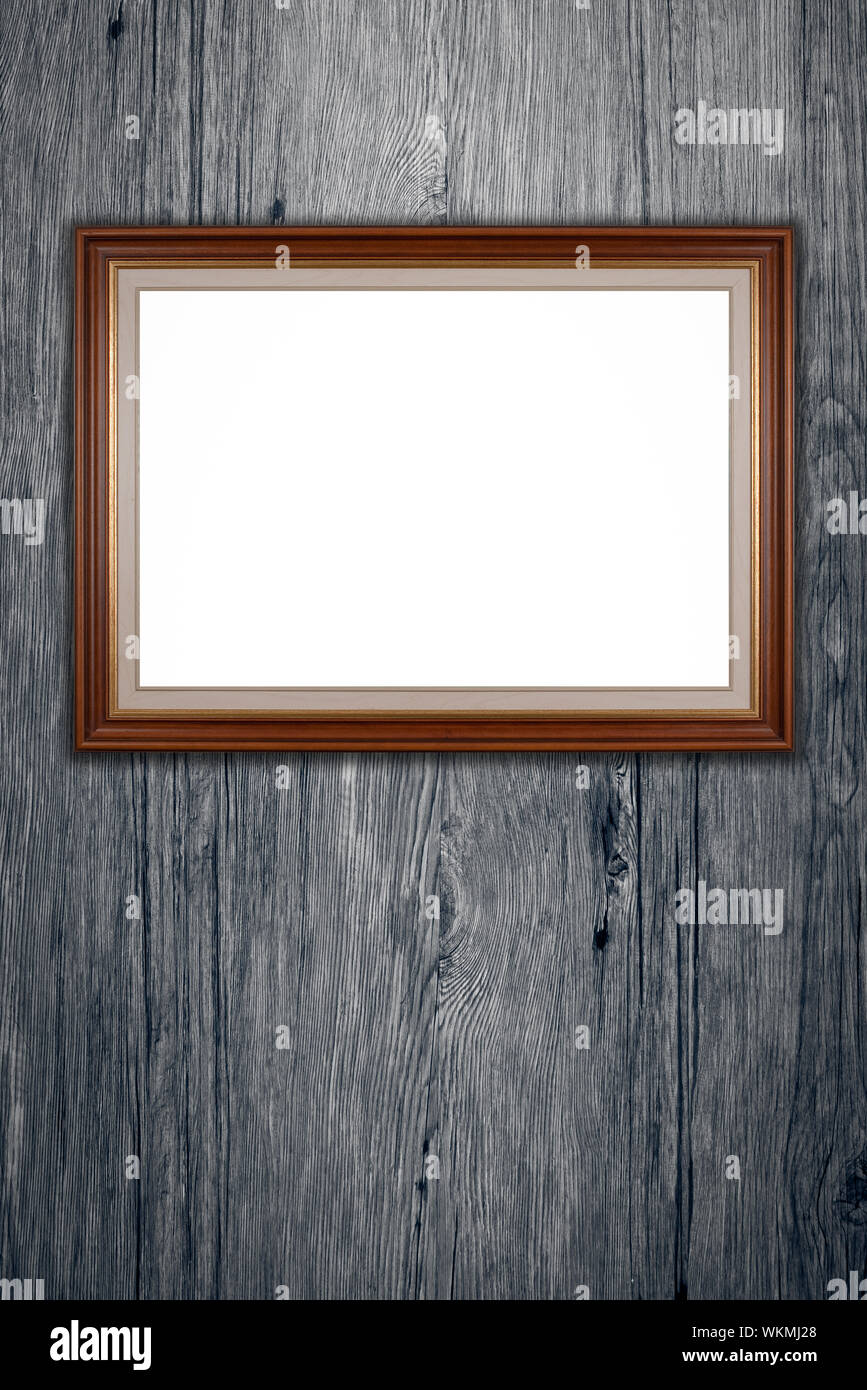 Old picture frame on vintage wood wall Stock Photo - Alamy