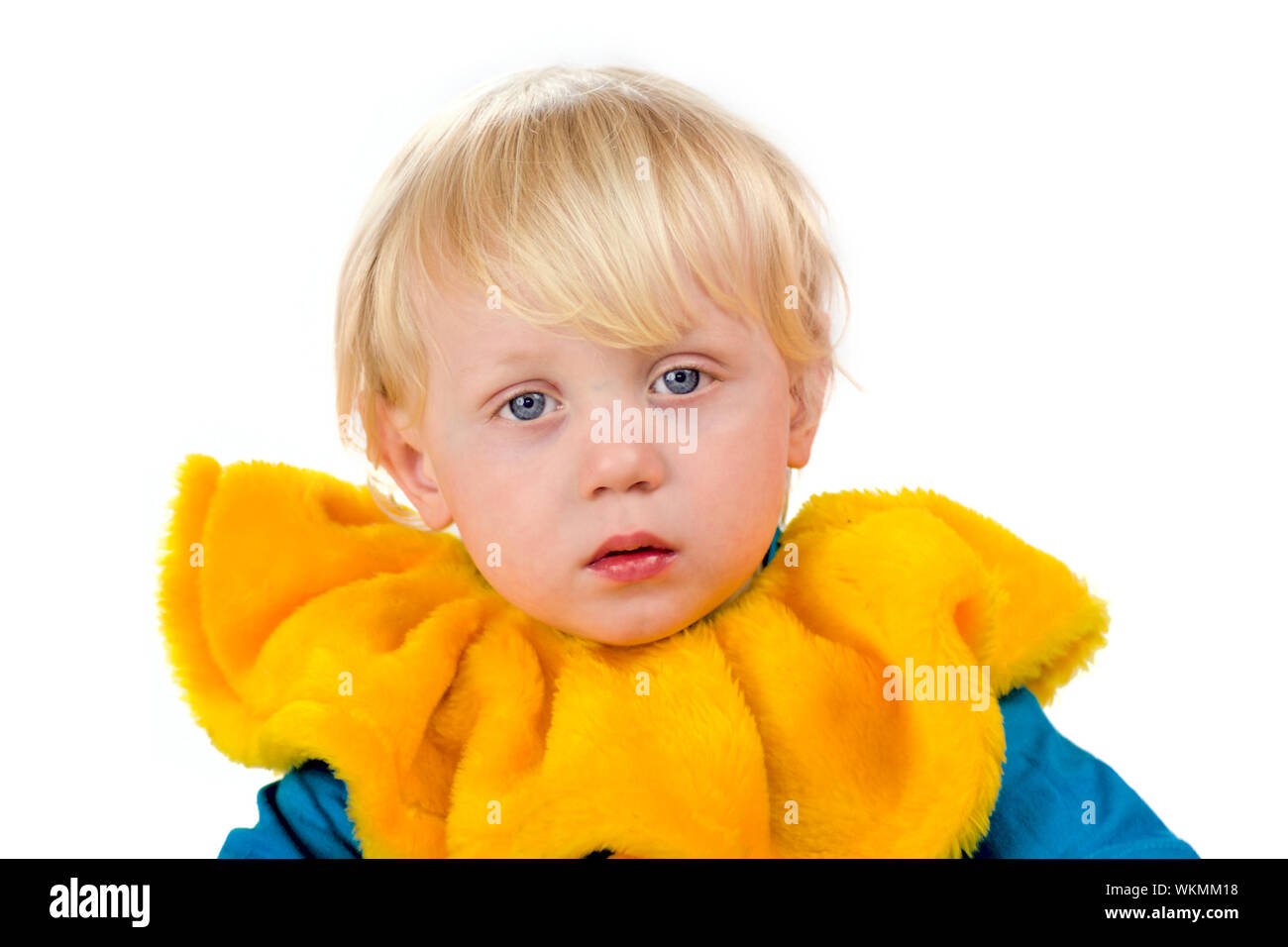 Portrait of Sad child wearing huge yellow clown collar isolated on white Stock Photo