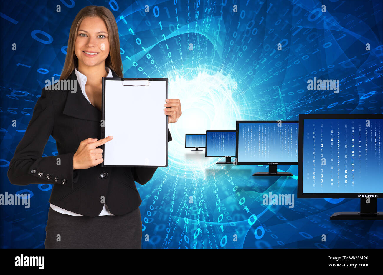 Businesswoman holding paper holder. Rows monitors with glowing figures as backdrop Stock Photo