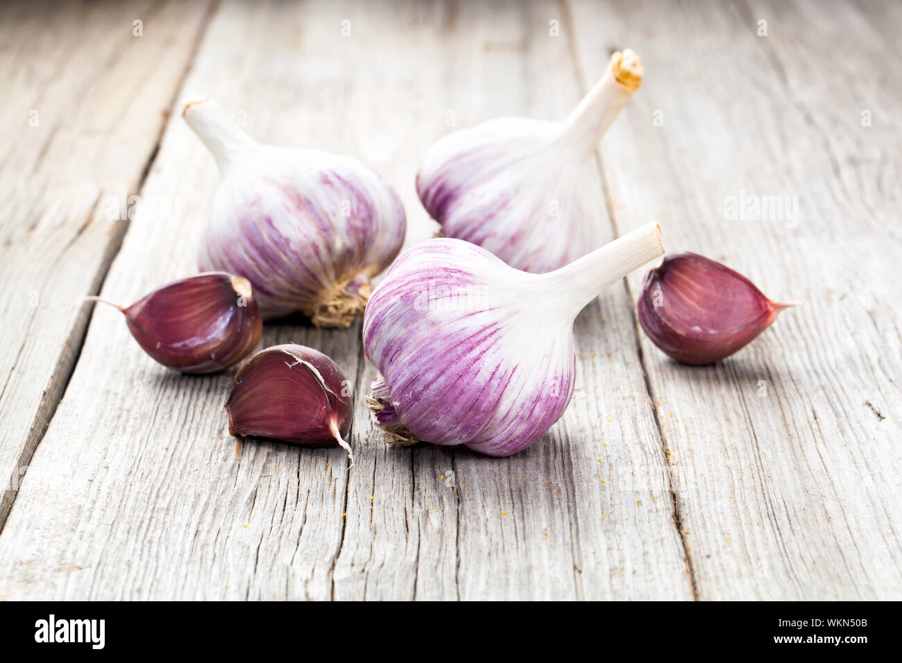 Organic garlic whole and cloves on the wooden background Stock Photo ...