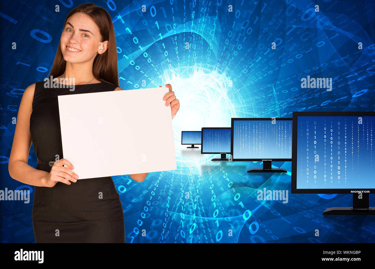 Businesswoman holding paper sheet. Rows monitors with glowing figures as backdrop Stock Photo