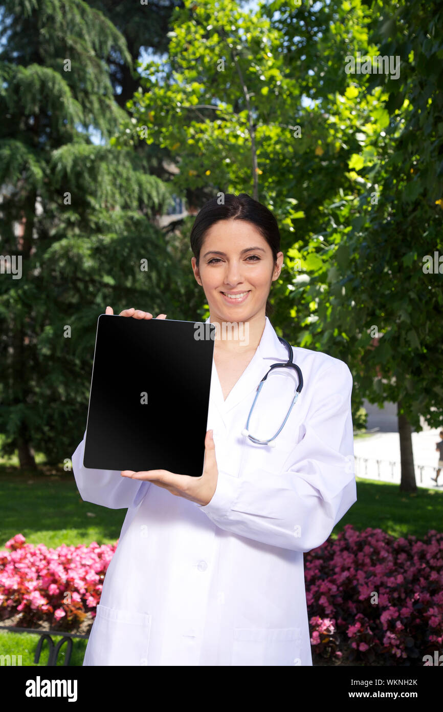 doctor woman showing tablet screen Stock Photo