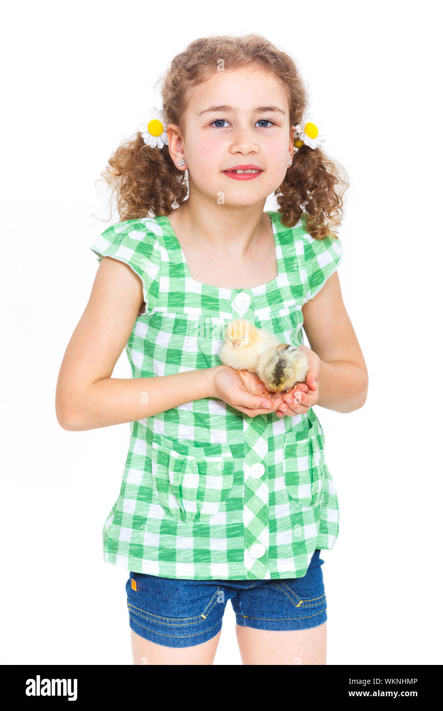 Happy little girl holding baby chickens - isolated white background Stock Photo