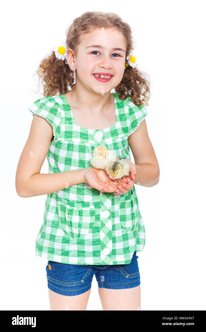Happy little girl holding baby chickens - isolated white background Stock Photo