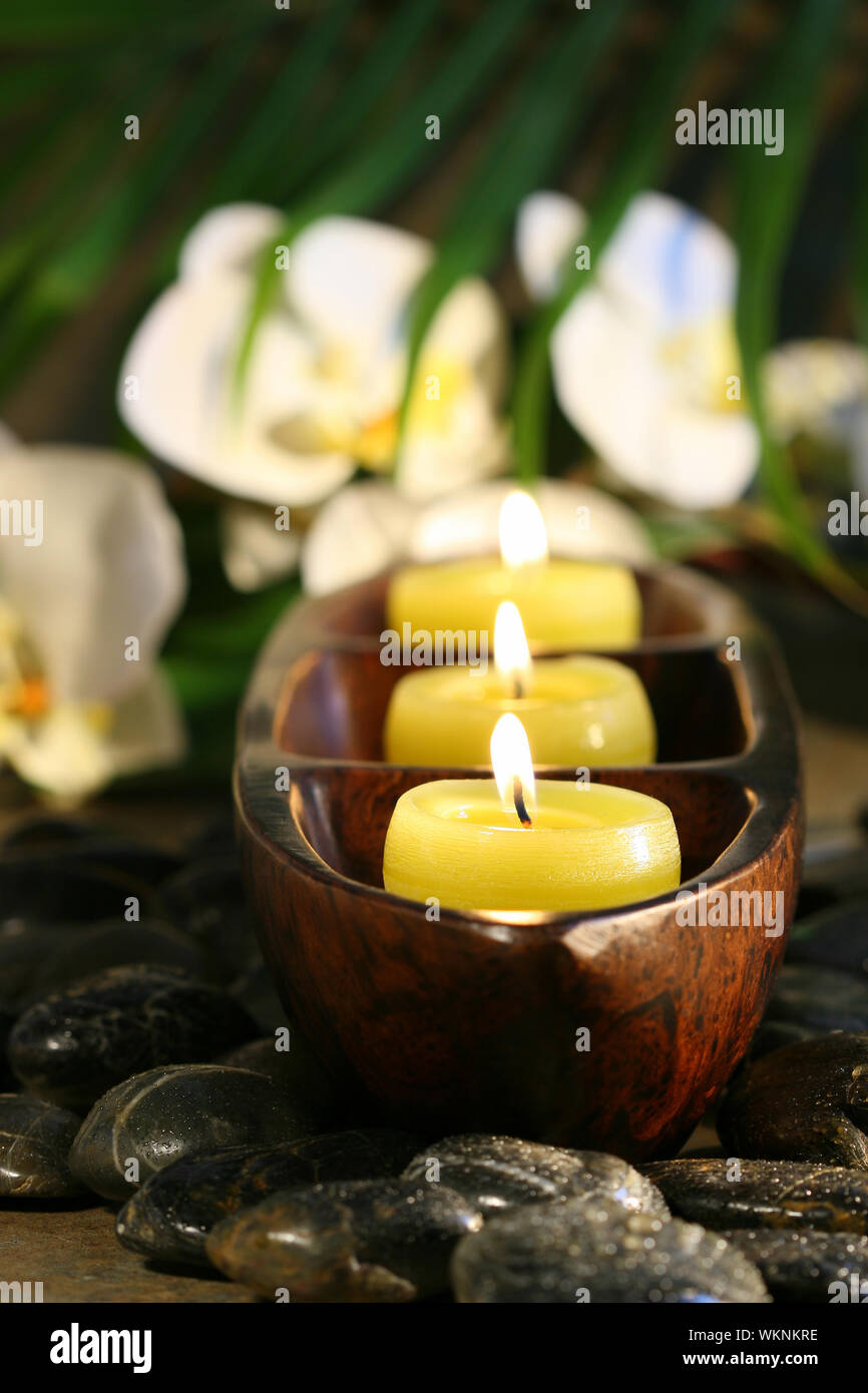 Spa setting with pebbles, candles for wellness concept Stock Photo Alamy