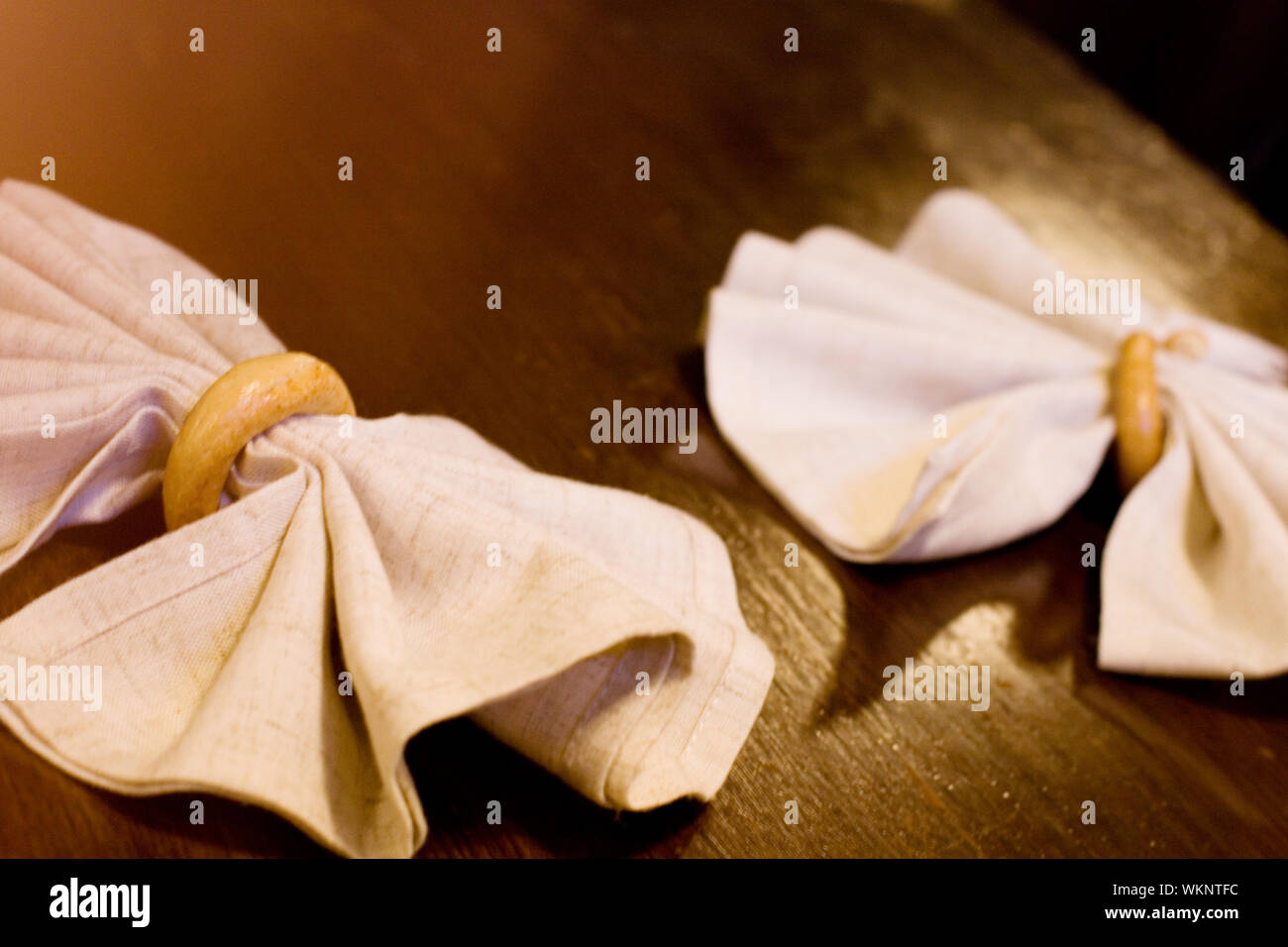 two napkins in rings on a table Stock Photo - Alamy