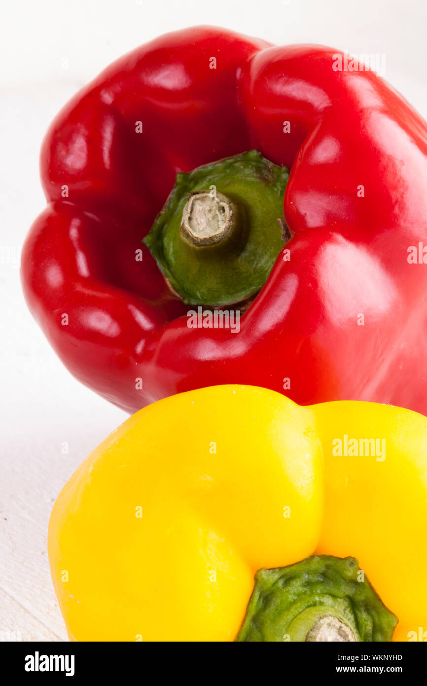 Red and Yellow Peppers on White Background Stock Photo - Alamy