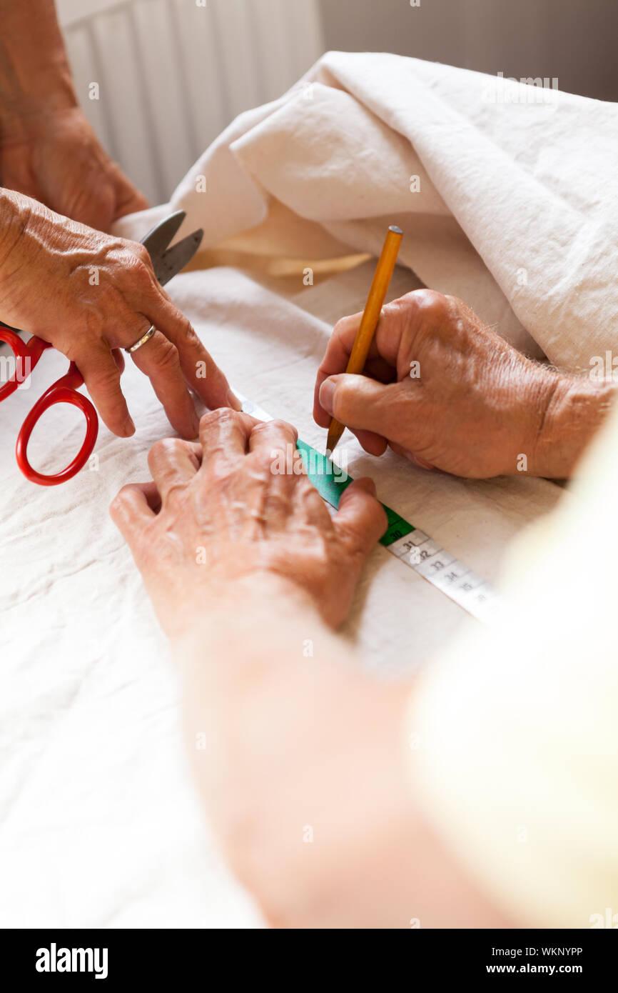 Hand Cutting Cloth with Scissors Stock Photo Alamy