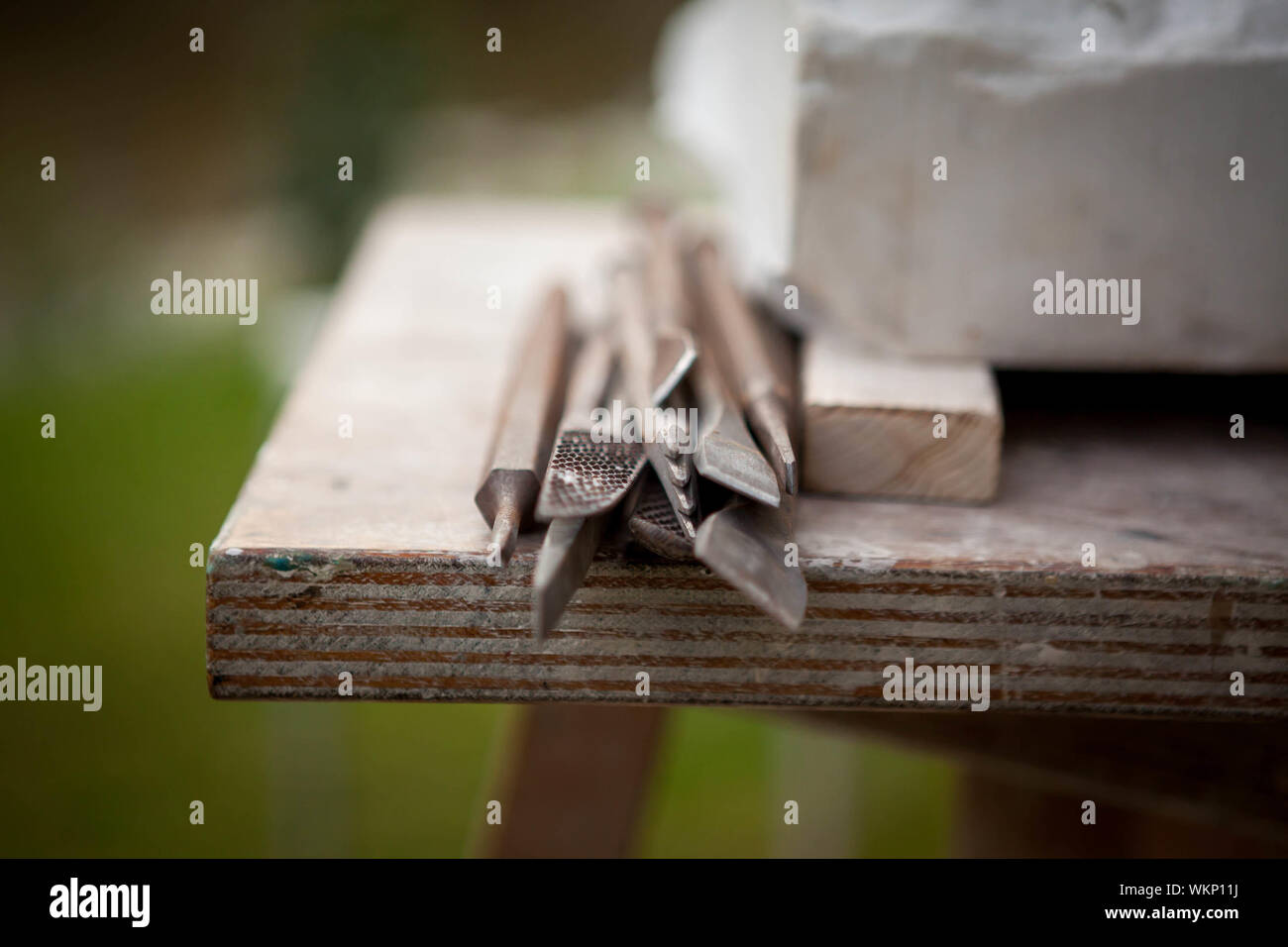 Sculpting Tools On Wooden Table In Yard Stock Photo