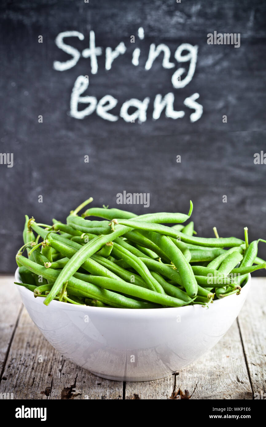green string beans in a bowl and blackboard Stock Photo Alamy
