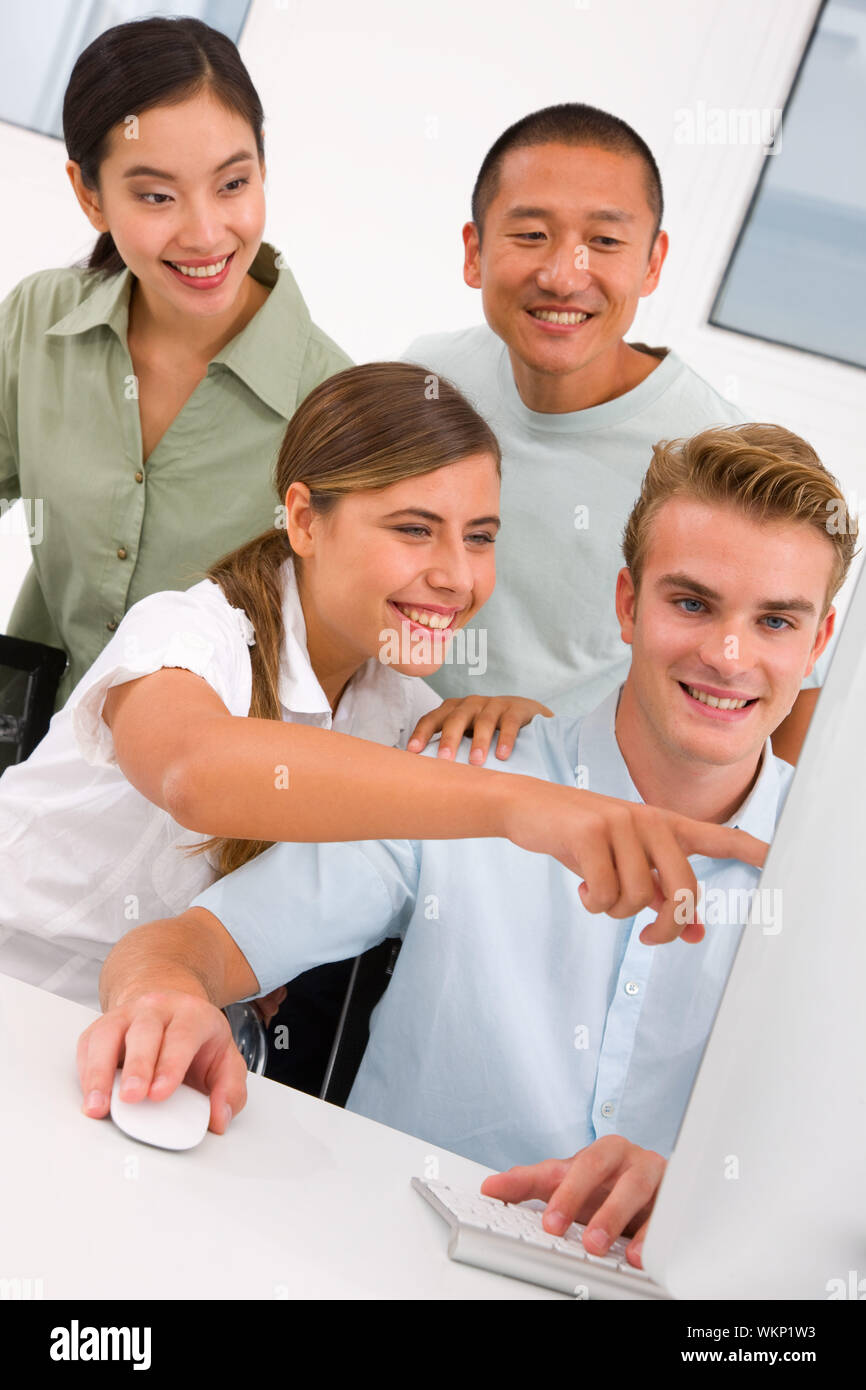 Successful businesspeople in office looking computer Stock Photo