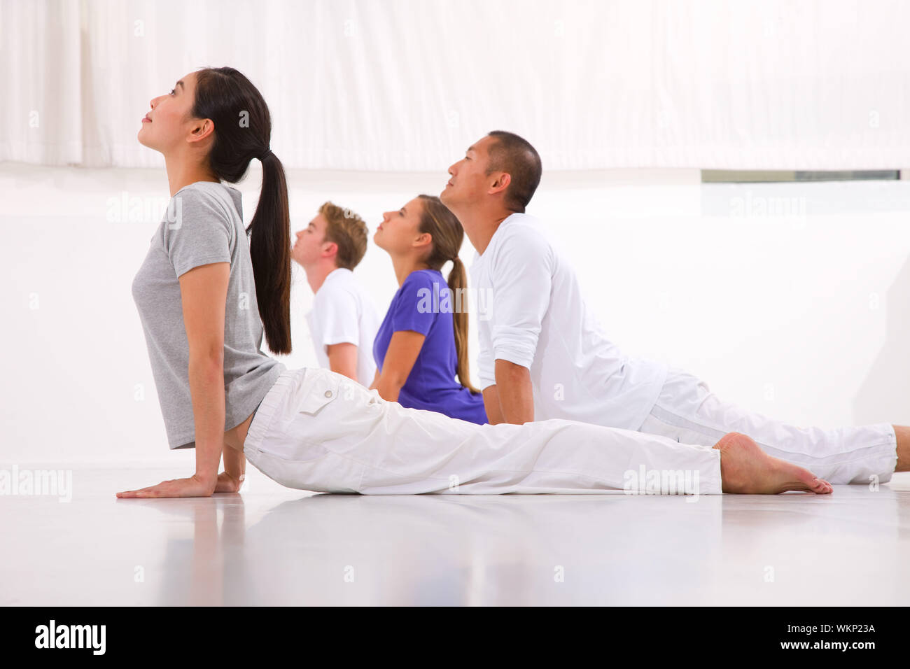 Diverse group of people practicing yoga Stock Photo