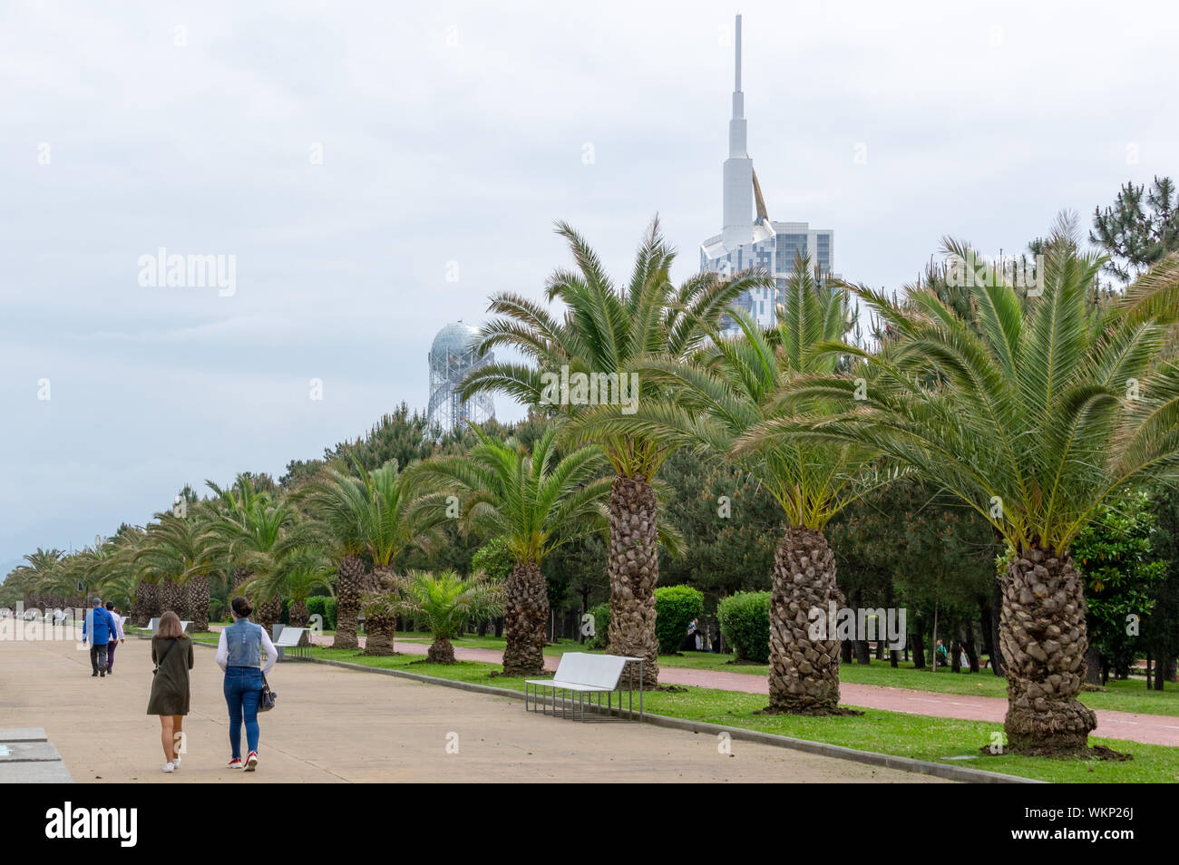 Seaside promedane in Batumi, Georgia, with red-painted bike lane and wide pedestrian street for vacationers Stock Photo