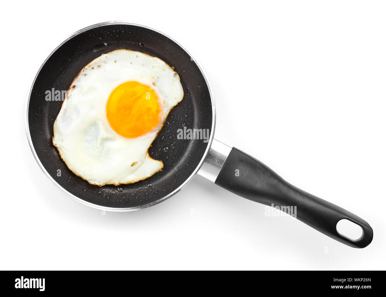 Fried egg in a frying pan, over white background Stock Photo
