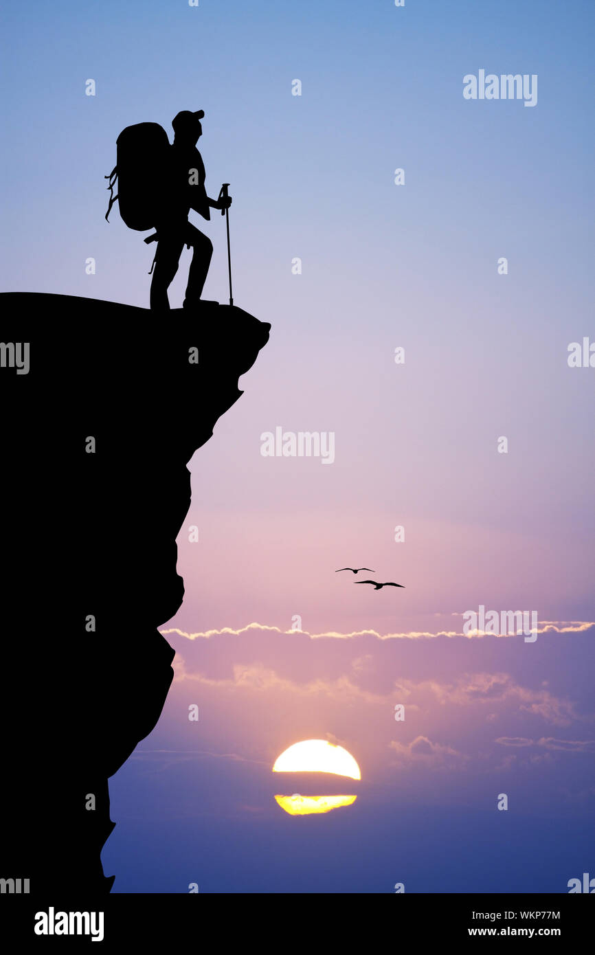Sunset hiker silhouette on rock hi-res stock photography and images - Alamy