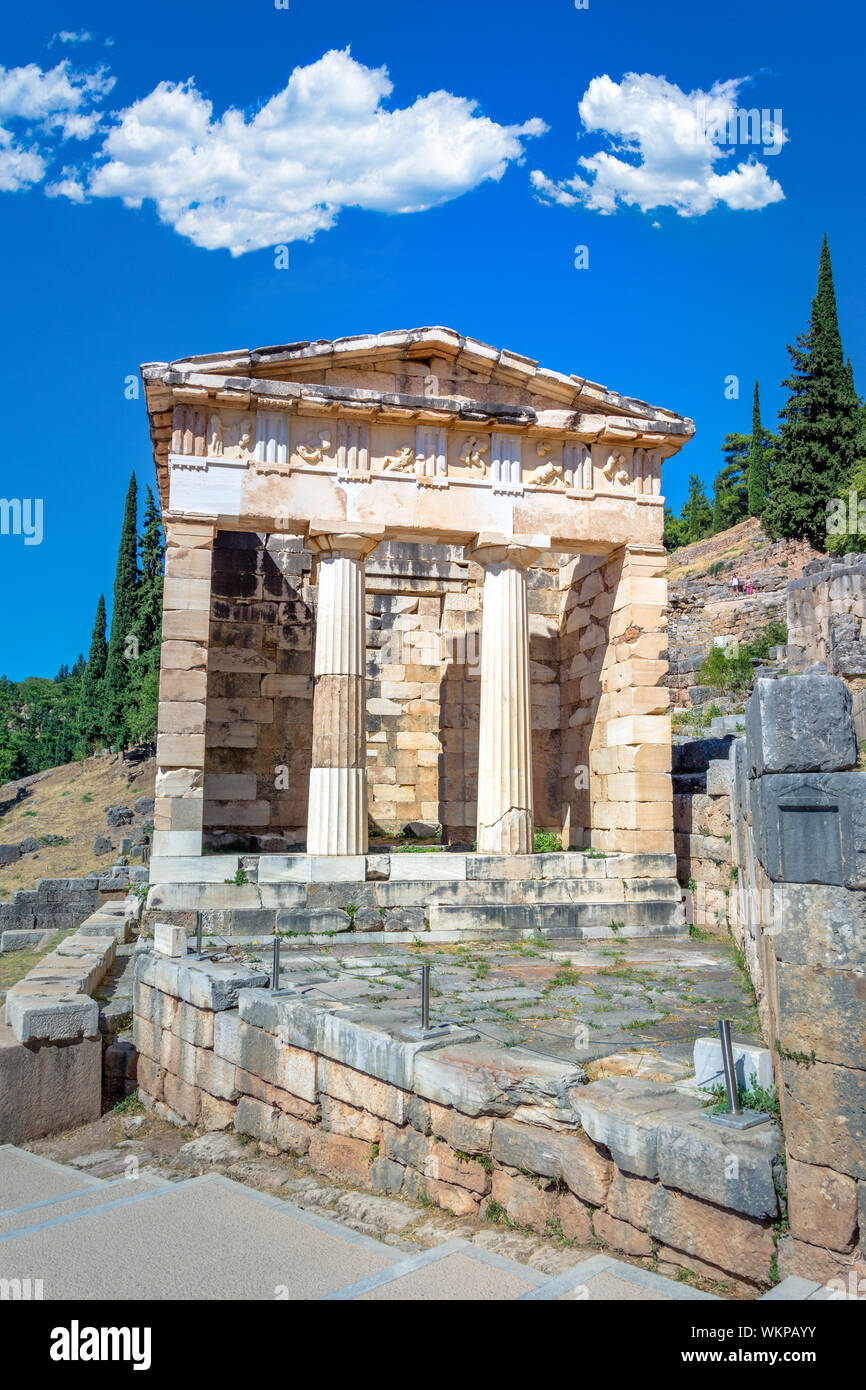 Ancient city of Delphi with ruins of the temple of Apollo, the omfalos (center) of the earth, theater, arena and other buildings, Greece Stock Photo