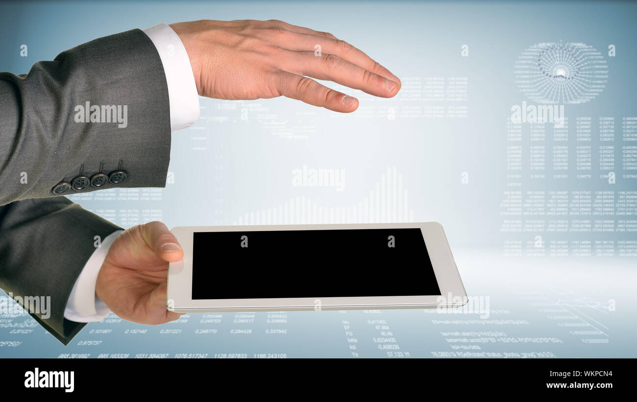 Two hands using tablet pc on hi-tech background Stock Photo - Alamy
