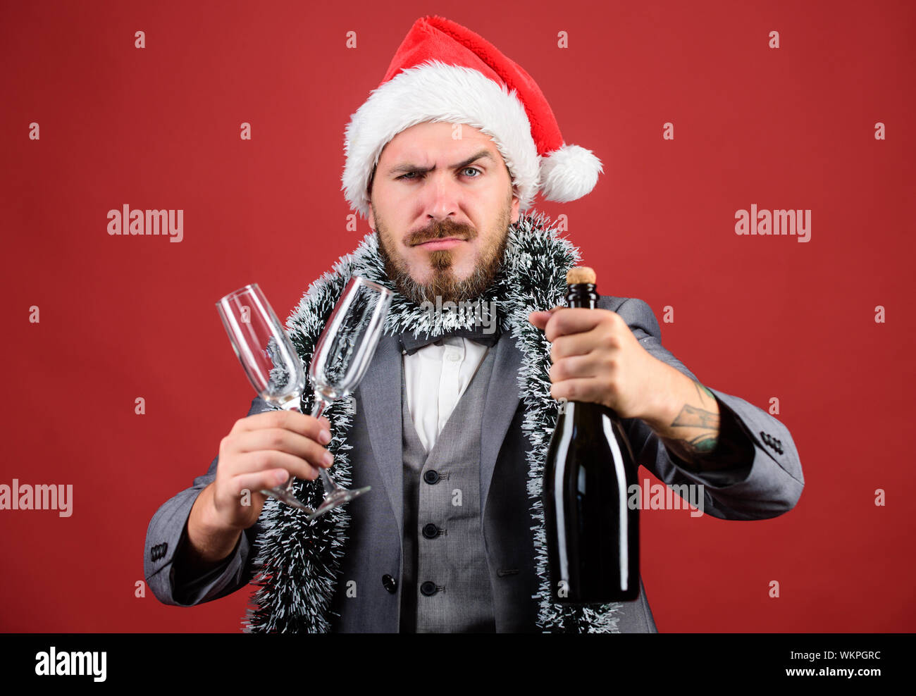 Christmas party invitation. Man bearded hipster santa hold bottle ...