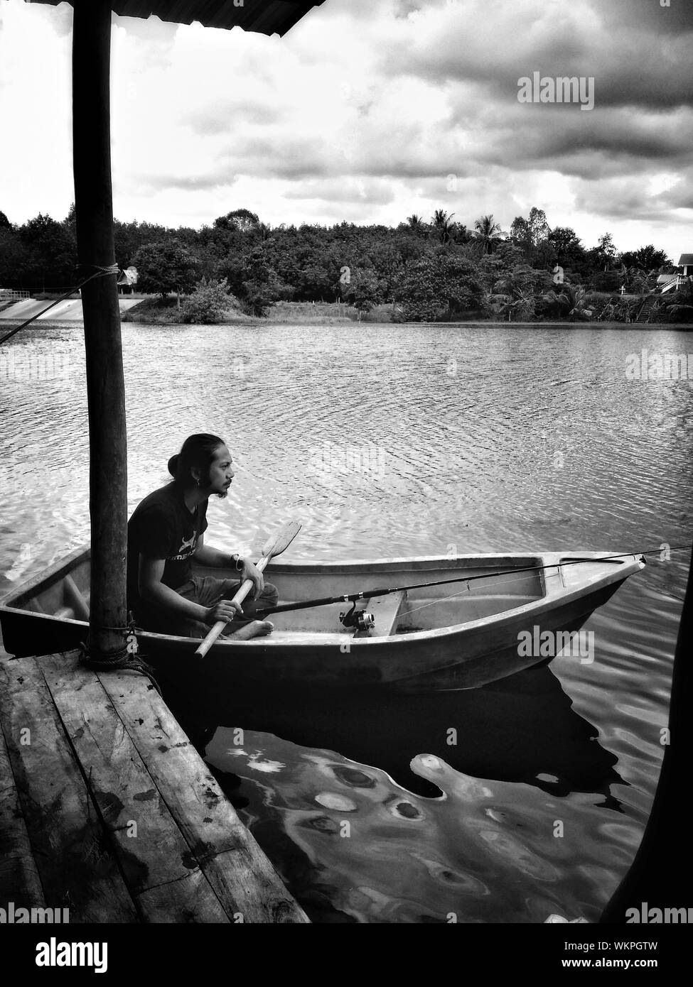Indian man sitting on boat hi-res stock photography and images - Alamy
