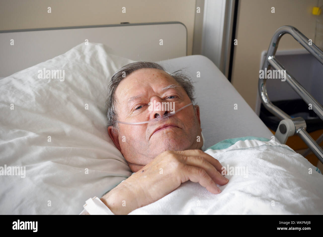 Portrait of sick old man in hospital bed Stock Photo Alamy