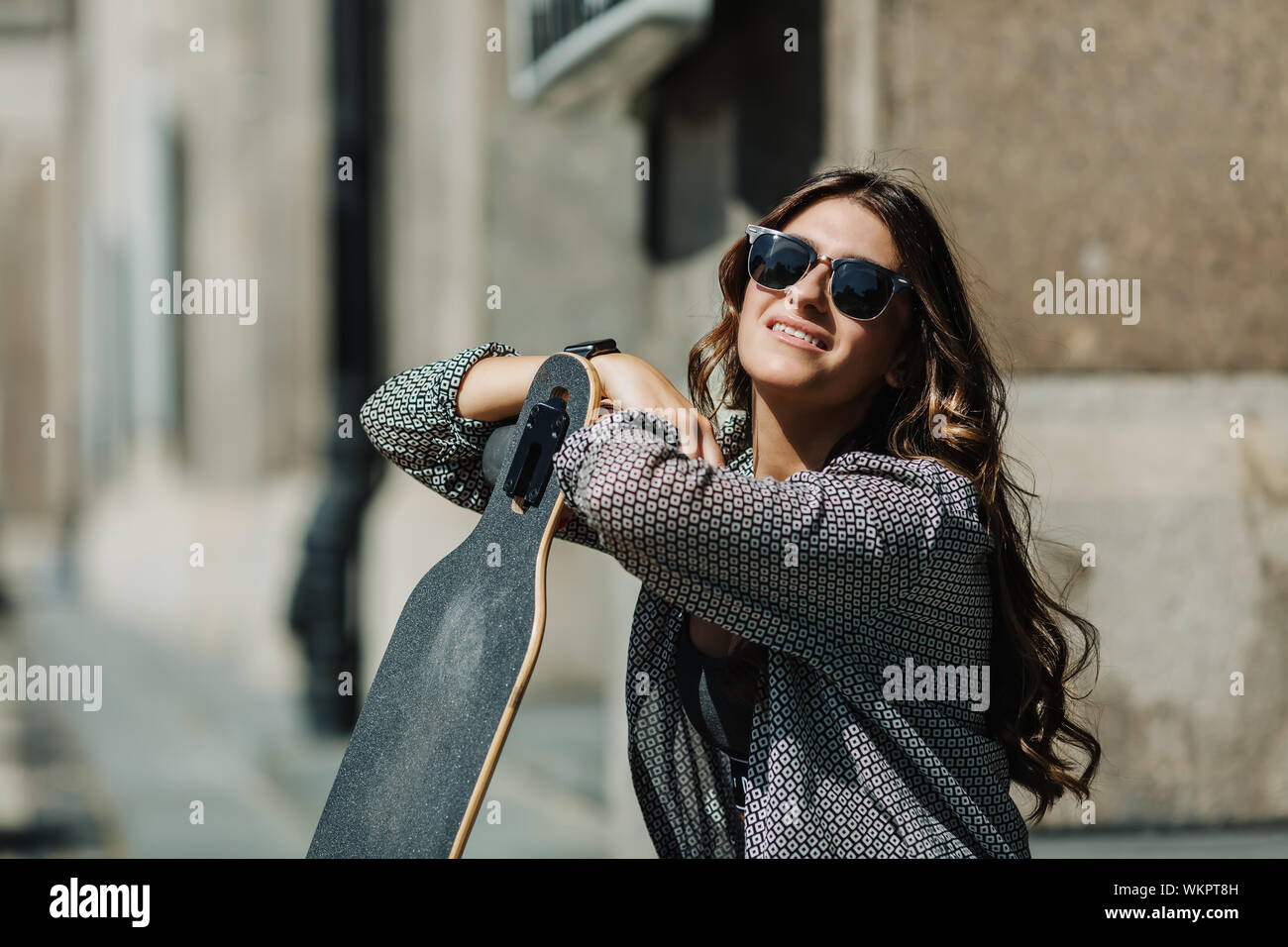 Close up Portrait of Beautiful young woman sitting on the ground and ...