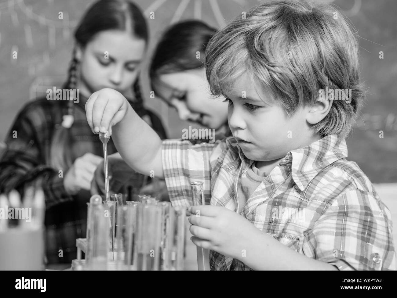 Laboratory Research - Scientific project For Chemical test. Science and education. chemistry lab. happy children. back to school. School chemistry laboratory. Working together to prepare for finals. Stock Photo