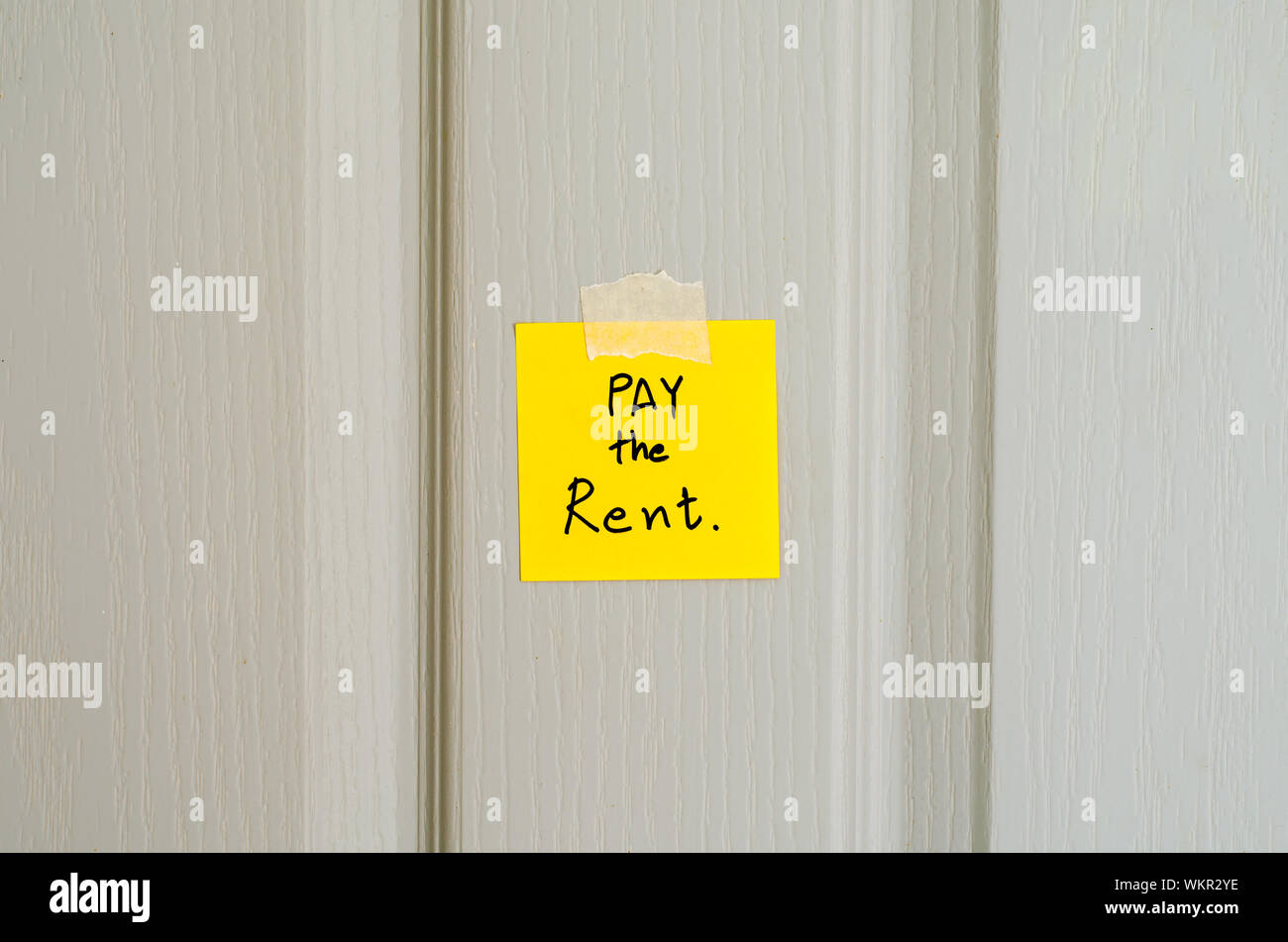 sticky note write a message pay the rent Stock Photo Alamy