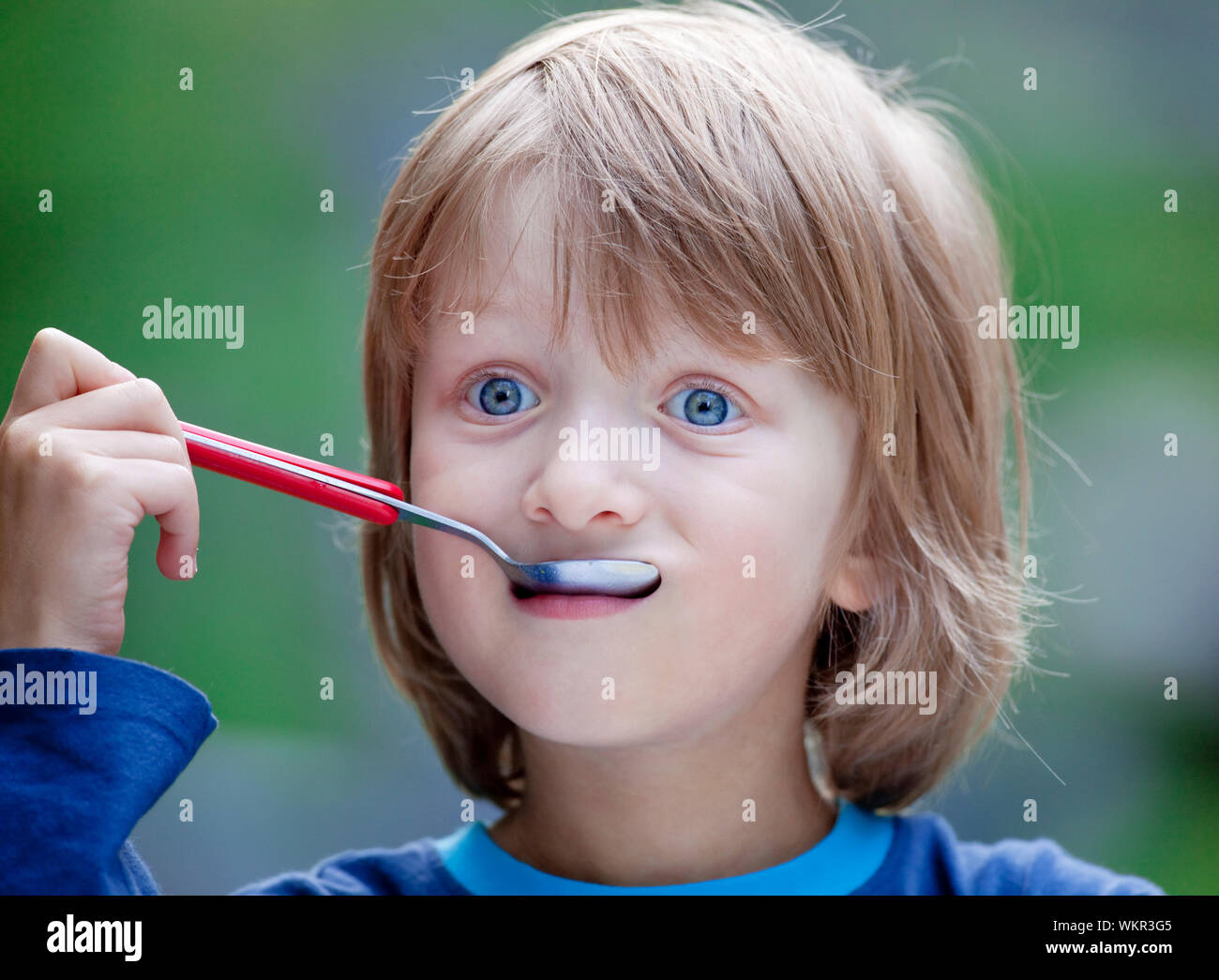 Boy with Blond Hair Eating Soup Stock Photo - Alamy