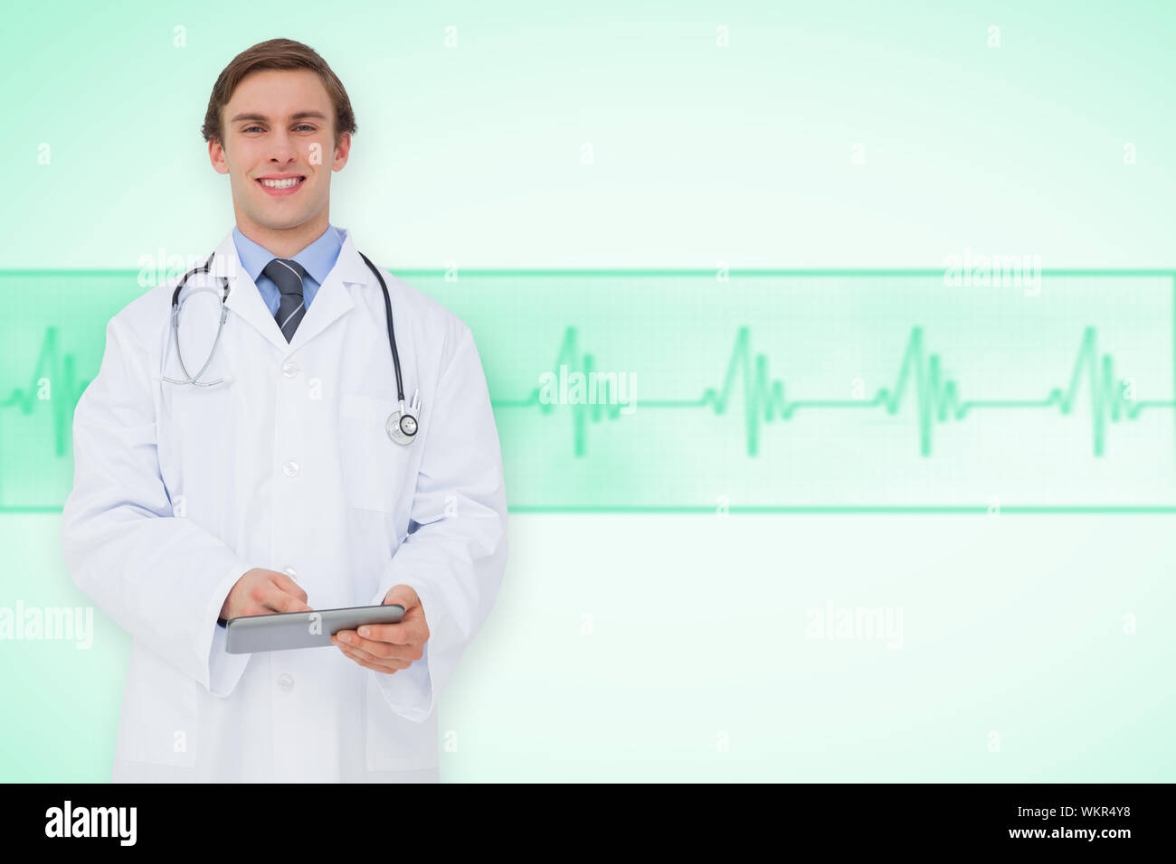 Young doctor using tablet pc against green medical background with ecg ...