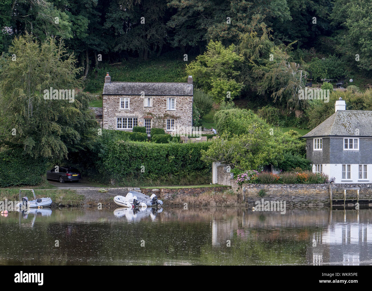 Boats moored on the River Fowey at Lerryn, Cornwall, England Stock Photo