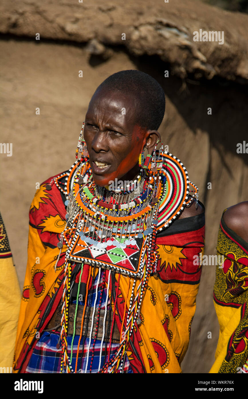 Adult Maasai Woman wearing traditional beaded necklace, jewelry, earrings, village near the Masai Mara, Kenya, East Africa Stock Photo