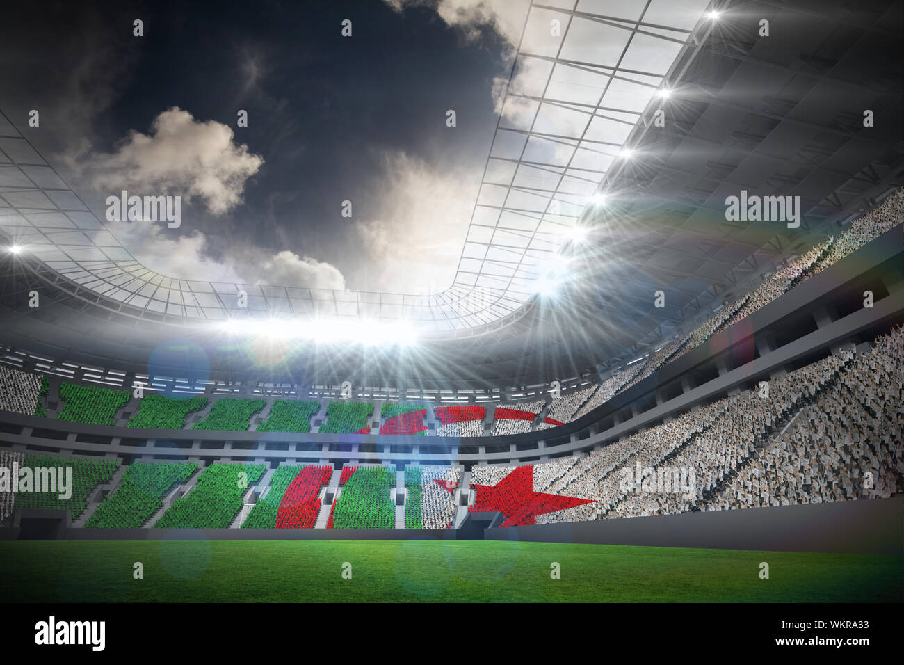 Algerian flag against football stadium with fans in white Stock Photo