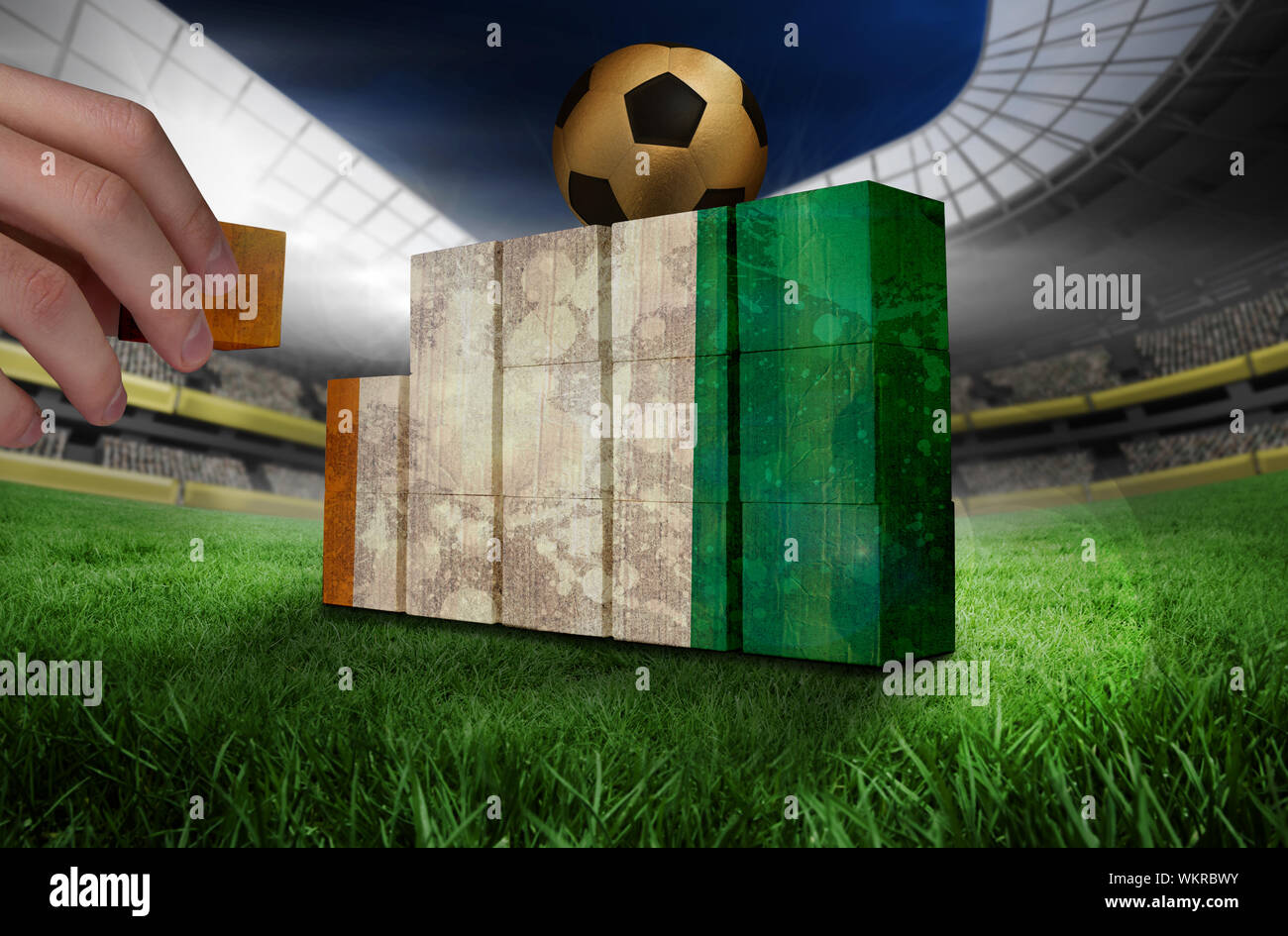 Hand building wall of ivory coast flag in grunge effect Stock Photo - Alamy