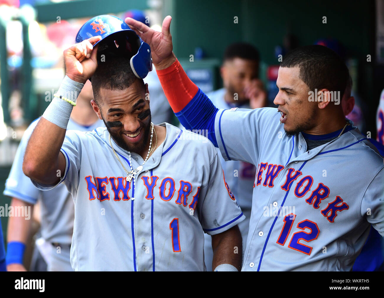 Washington, United States. 04th Sep, 2019. New York Mets Amed Rosario (1) is congratulated by teammate Juan Lagares in the dugout after scoring off of a single hit by Jeff McNeil against the Washington Nationals in the sixth inning at National Park in Washington, DC on Wednesday, September 4, 2019. Photo by Kevin Dietsch/UPI Credit: UPI/Alamy Live News Stock Photo