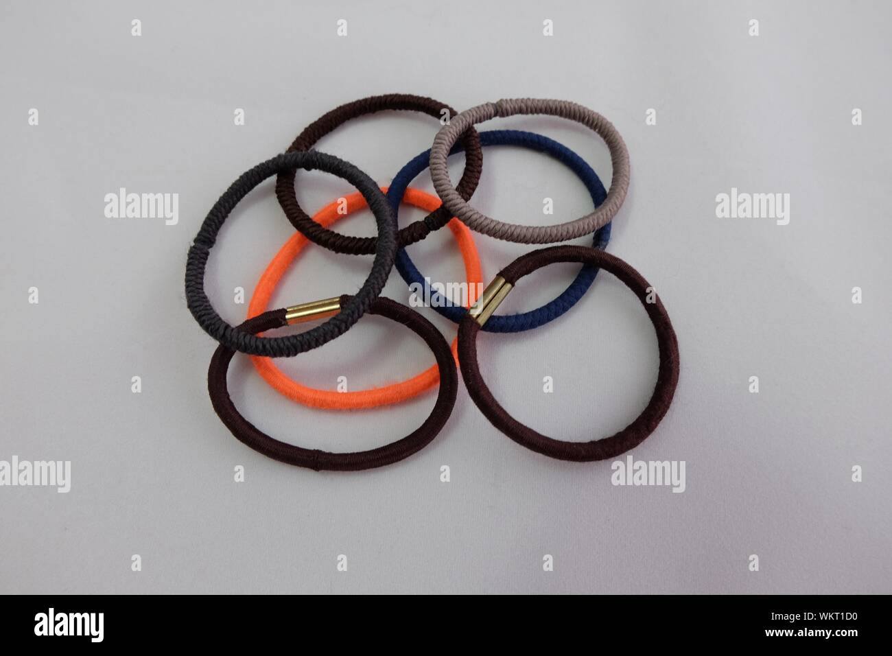 Close-up Of Hair Bands On White Background Stock Photo