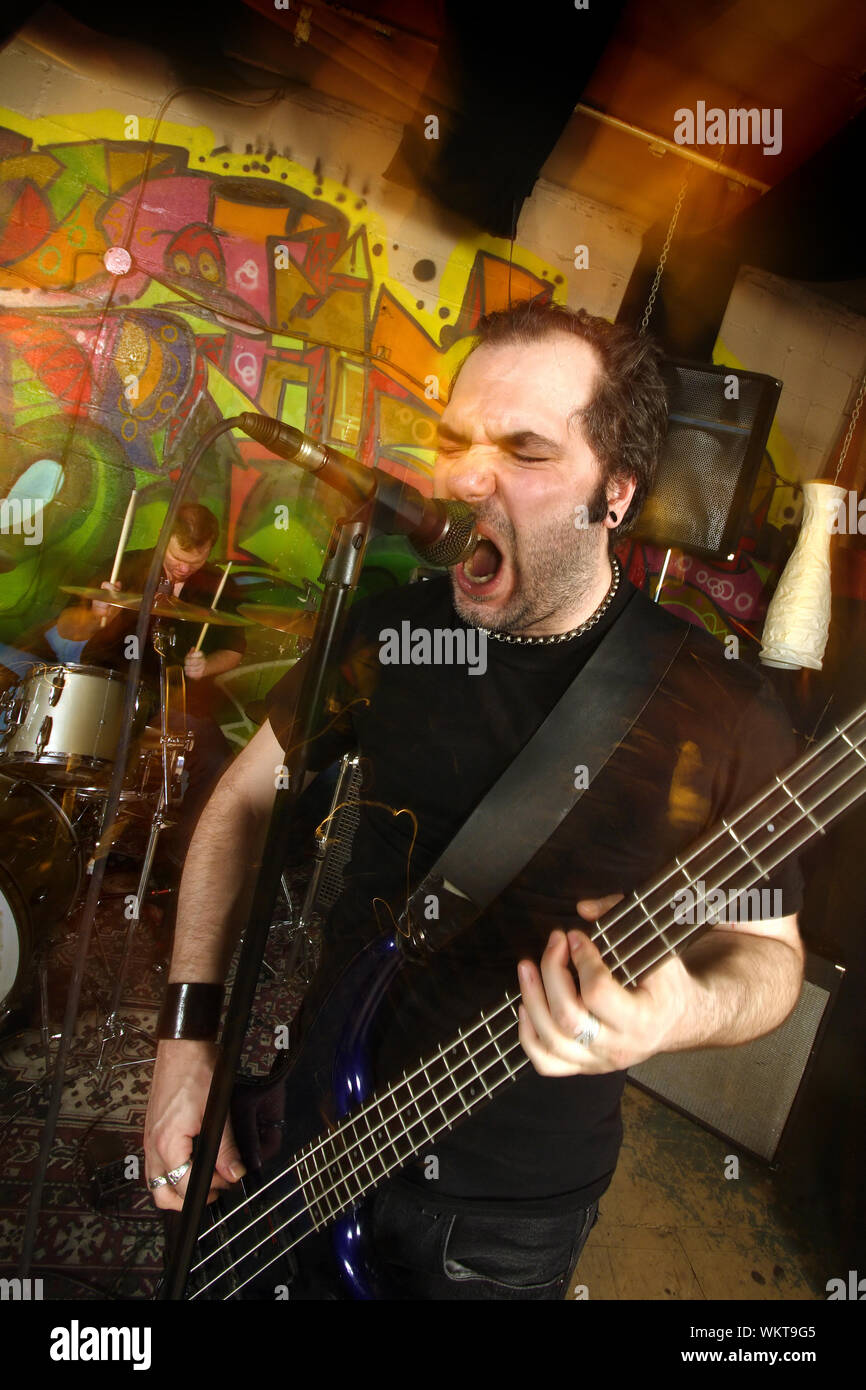 Aggressive bass player Stock Photo Alamy