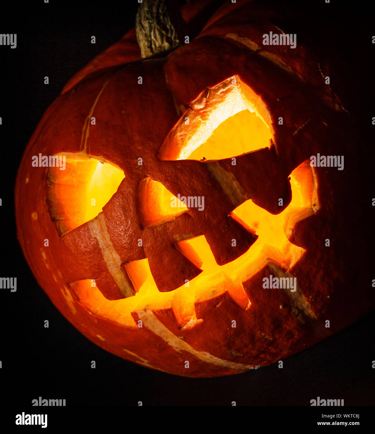 Halloween - old jack-o-lantern on black background Stock Photo