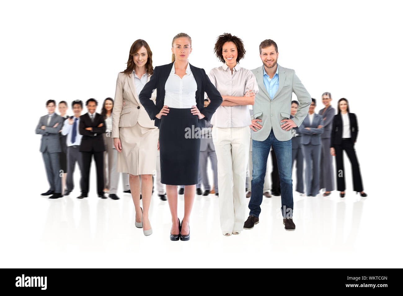 Composite image of business team looking at camera on white background ...