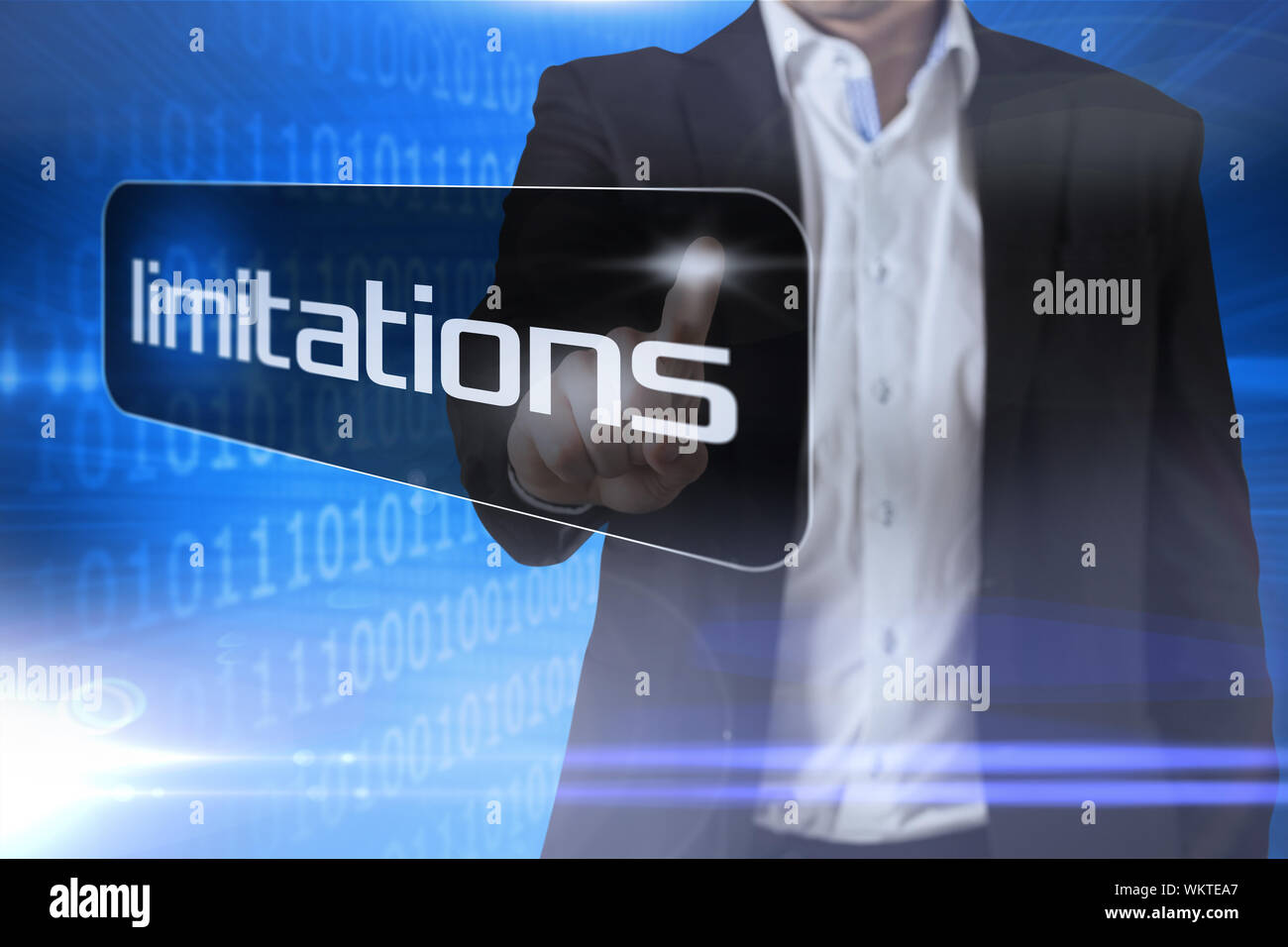 Businessman pointing to word limitations against futuristic shiny binary code Stock Photo