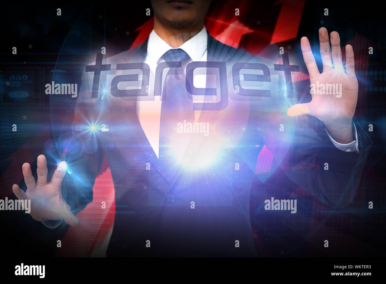Businessman presenting the word target against shiny red arrows on black background Stock Photo