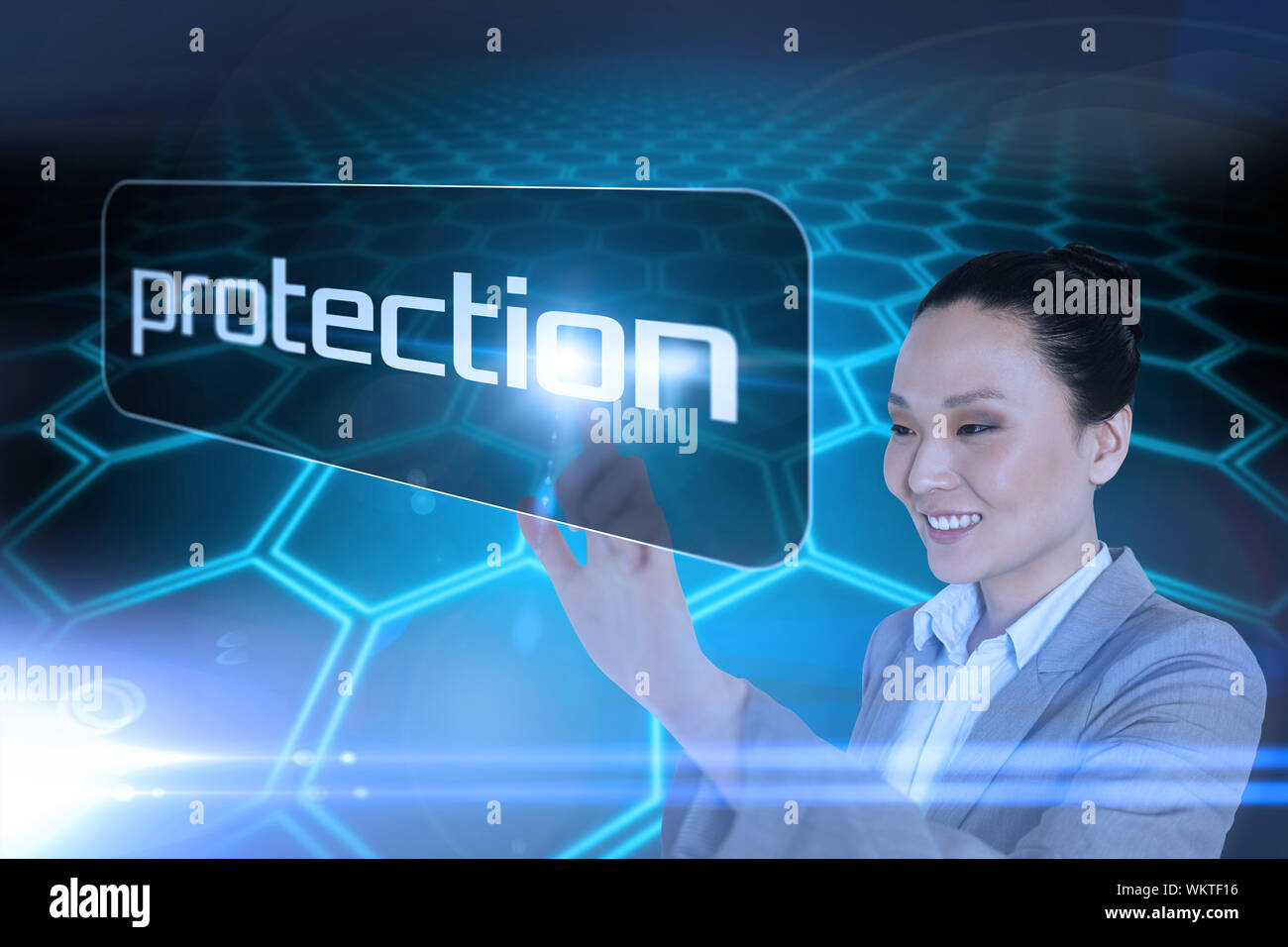 Businesswoman pointing to word protection pointing against black background with shiny hexagons Stock Photo